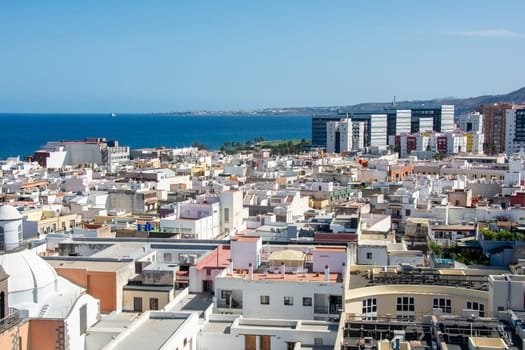 Panoramic top view of the capital Las Palmas Gran Canaria in Spain with blue sky and sea
