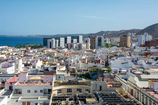 Panoramic top view of the capital Las Palmas Gran Canaria in Spain with blue sky and sea