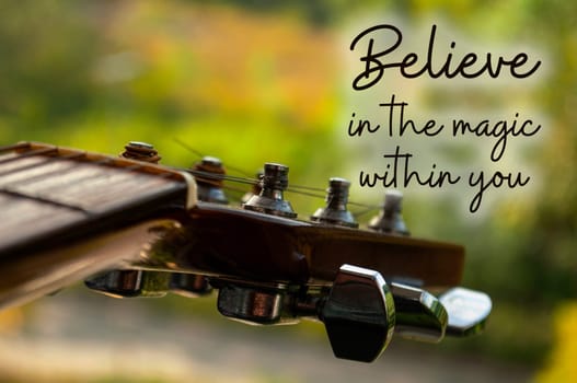 Motivational and inspirational quote - Believe in the magic within you. With Guitar background