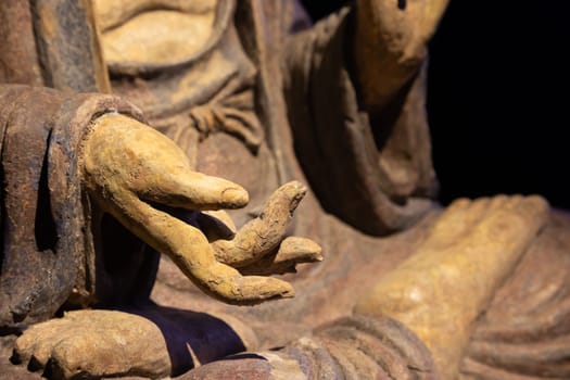 Ancient Buddha hand. Concept of energy, ethnic, harmony, meditation, peace