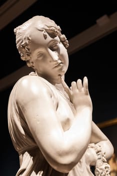 Bassano del Grappa, Italy - December 2022: Dancer with finger on her chin, by Antonio Canova, 1814. Classic statue, Roman beauty