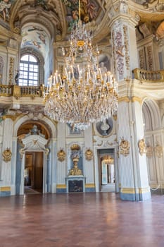 Italy, Stupinigi - January 2023: luxury interior of Royal Palace with baroque marbles and windows