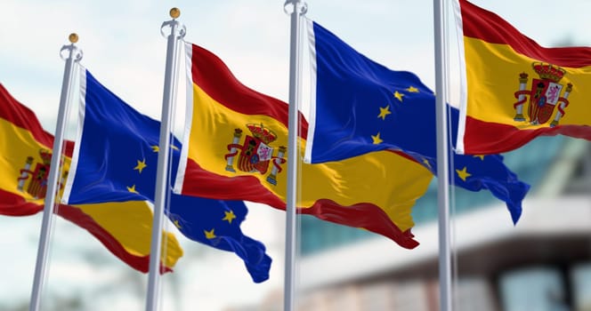Spanish and European Union flags waving in the wind. International cooperation and partnership. European union membership. 3d illustration render. Selective focus. Rippling fabric