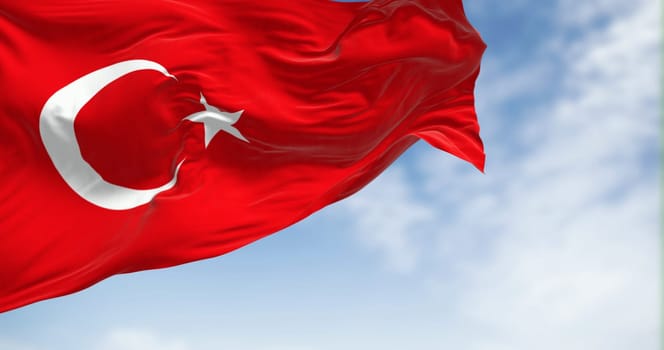 Turkish national flag waving in the wind on a clear day. Red flag with white crescent and a star. 3D illustration render. Fluttering fabric