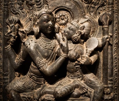 Turin, Italy - April, 2023: Oriental Art Museum. Shiva and Parvati, 10th Century A.D. For Hinduism religion the couple is symbol of love and devotion - traditional practice of sex, tantra and kamasutra