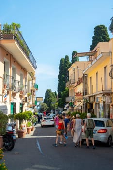 Sicily, Taormina, Italy - 28 September 2023. Tourists in the main street Corso umberto in Taormina. City views, facades, architecture and the most popular streets.