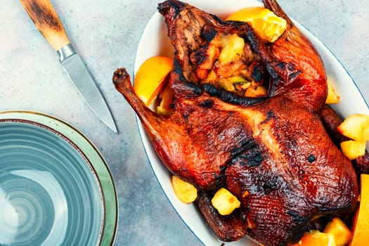 Whole duck baked with oranges and caramelized apples.