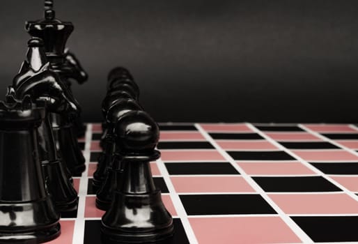 Selective view of chess pawn moving toward for battle. Strategy and tactic concept.