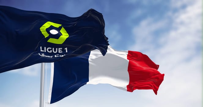 Paris, FR,Oct 15 2023: Ligue 1 and France national flag waving together. French professional league for men association football clubs. Illustrative editorial 3d illustration render.