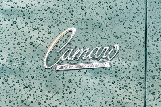 WETTENBERG, HESSE, GERMANY - 07 - 28 - 2023: CAMARO by Chevrolet Logo with raindrops in Detail on a traditional Car Show Golden Oldies.