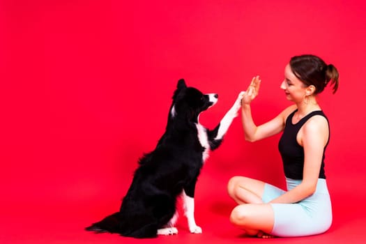 Friendship between people and animals, a studio shot, love, tender, warm feeling and emotion