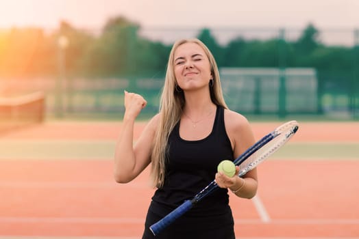 Tennis tournament. Female player at clay tennis court