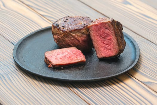 Pan seared fillet mignon on a plate