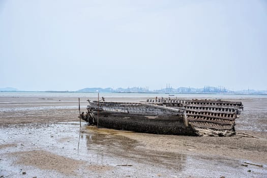 The remains of a fishing boat left on the beach.
