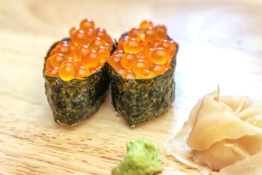 Sashimi sushi on the wood table. Sushi is a type of food preparation originating in Japan.