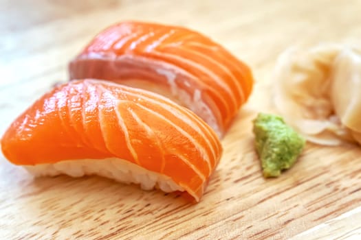 Sashimi sushi on the wood table. Sushi is a type of food preparation originating in Japan.