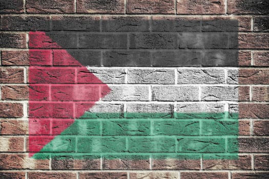 A Palestine flag on old brick wall background