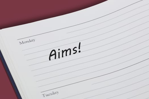 An aims reminder message in an open diary