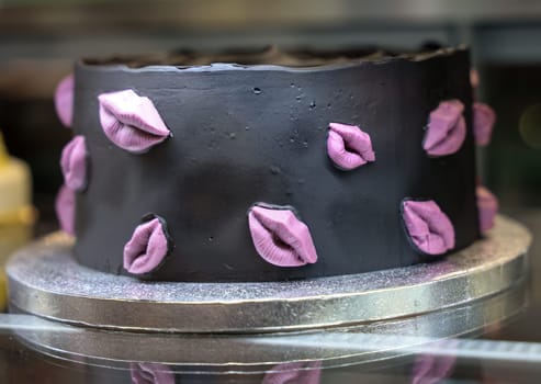 Chocolate cake decorated with sweet pink lips