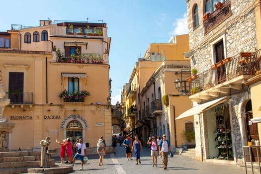 Sicily, Taormina, Italy - 28 September 2023. The Piazza del Duomo Taormina is a popular spot for both locals and visitors - you can rest on the steps of the fountain.