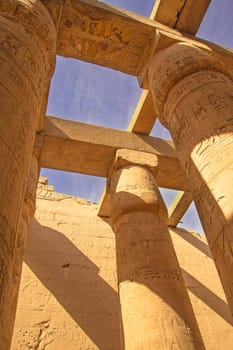 Great Hypostyle Hall and blue sky in the backgrouns at the Temples of Karnak (ancient Thebes). Luxor, Egypt.  Vertically.