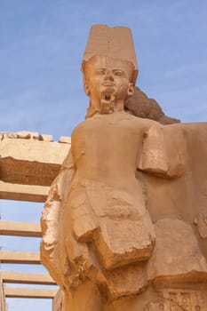 Statue in the temple complex at Karnak. Luxor. Egypt. Vertically.
