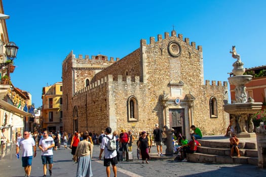 Sicily, Taormina, Italy - 28 September 2023. The Piazza del Duomo Taormina is a popular spot for both locals and visitors - you can rest on the steps of the fountain.
