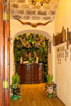 Sicily, Taormina, Italy - 28 Sep 2023. Ristorante Pizzeria Taormina. A lovely pizza, pasta and seafood restaurant in the centre of Taormina with beautiful views of the sea. Entrance area interior.