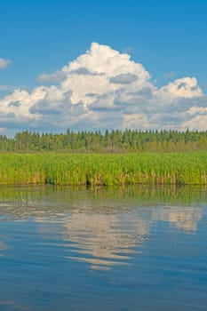 Storm Clouds Over a Quiet Pond at Ominnik Marsh in Riding Mountain National Park in Manitoba