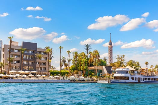 Picturesque bank of the Nile and Tower of Cairo, Egypt.