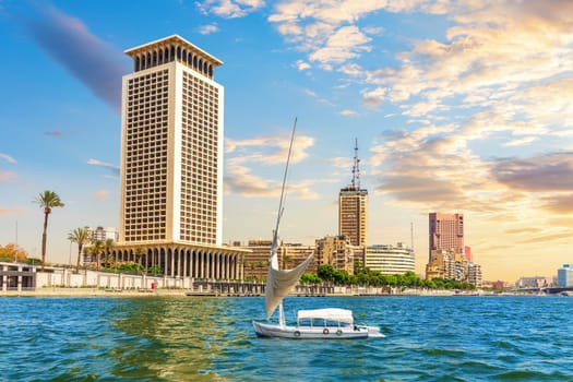 Sailboat iin the Great Nile river and the banks of Cairo, Egypt.