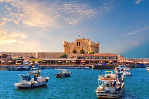 Boats in the harbour near famous Citadel of Qaitbay, Alexandria, Egypt.