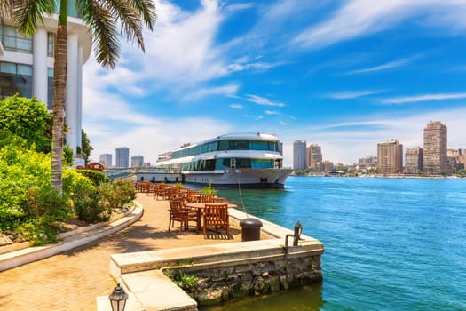 Bank of the Nile and view on modern Cairo, bright colors of the capital of Egypt.