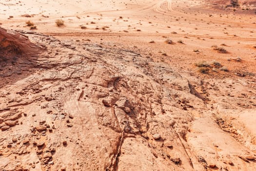 Sun shines to red orange sandstone rocks formations in Wadi Rum (also known as Valley of the Moon) desert, Jordan.