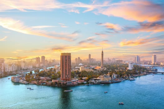 Sunset over the Nile river, fancy buildings and TV tower of Cairo, Egypt.