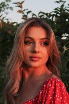 Beautiful sexy attractive girl enlightened by sunset.