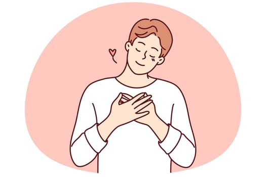 Happy man hold hands on chest