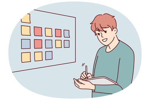 Motivated businessman brainstorm wok with sticky notes on board in office. Male employee or worker involved in creative thinking at workplace. Vector illustration.