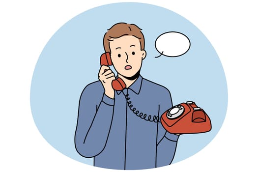Stunned young man talking on landline phone. Amazed male with speech bubble above head speak on wired headset. Vector illustration.