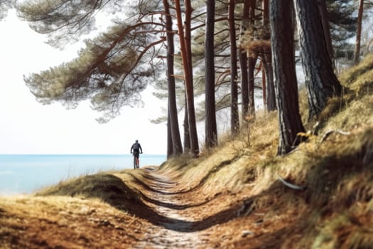 Man riding bicycle at the seaside. Cycling by the sea. Active person. Cardio training. Physical fitness. Cardio workout. Healthy lifestyle. Daily routine. Body exercises