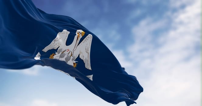 Louisiana state flag waving on a clear day. Mother pelican in a blue area with the slogan of the state. US state flag. 3d illustration render. Fluttering fabric. Selective focus