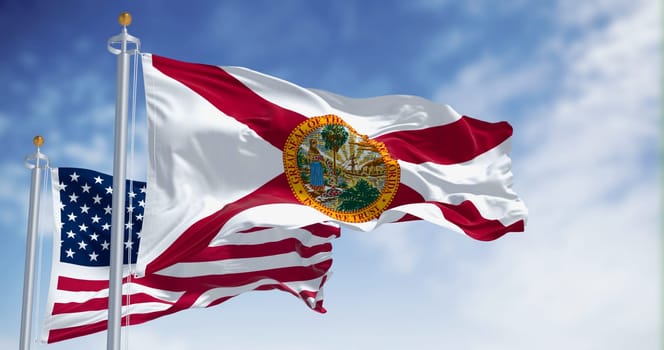 Flags of Florida and United States waving in the wind on a clear day. US state flag. Pride and patriotism concept. 3d illustration render. Fluttering textile