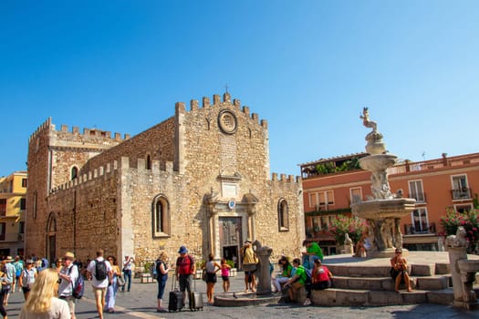 Sicily, Taormina, Italy - 28 September 2023. The Piazza del Duomo Taormina is a popular spot for both locals and visitors - you can rest on the steps of the fountain.