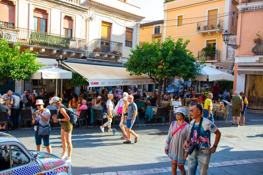Sicily, Taormina, Italy - 28 September 2023. Tourists in the main street Corso umberto in Taormina. City views, facades, architecture and the most popular streets.
