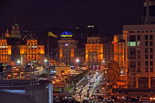Night street with burning lanterns. Kyiv street at night. Lights of night city. Lights of night city. Panorama of Kyiv street illuminated by lights at nighttime