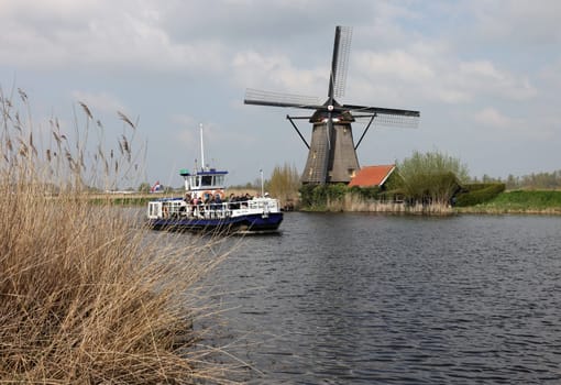 Kinderdijk, the Netherlands - April 17, 2023: 19 windmills at Kinderdijk built about 1740 is part of a larger water management system to prevent flooding. A UNESCO world heritage site.