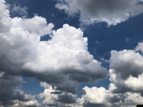 cloudscape fluffy cumulus clouds in blue sky skyscape