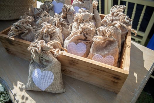 Sachets of rice ready to throw away after a wedding ceremony. Wooden box container