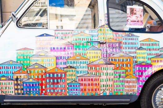 Genova, Italy - 6 August 2023: vintage Fiat 500 car painted with traditional cityscape of Liguria Region - Italy travel destination