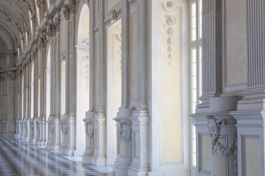 Venaria Reale, Italy - 16 July 2023: luxury gallery perspective, decorative marble, indoor, nobody, Royal Palace. Italy travel destination.